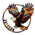 Colorful eagle metal sign with outstretched wings, circular frame, and stained-glass inspired artwork