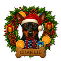 Custom Miniature Pinscher metal sign featuring a Santa hat, holiday wreath, gifts, and a bone-shaped accent