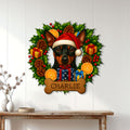 Miniature Pinscher holiday metal sign displayed on a bright paneled wall above a console table
