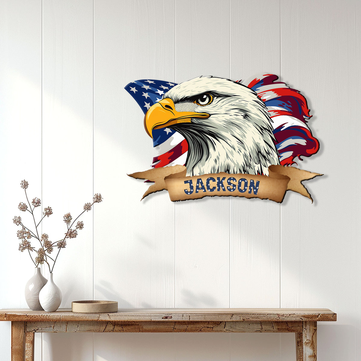 Patriotic bald eagle metal sign displayed on a white paneled wall above a rustic console table