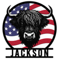 Highland cow metal sign with bold horns and a patriotic American flag background