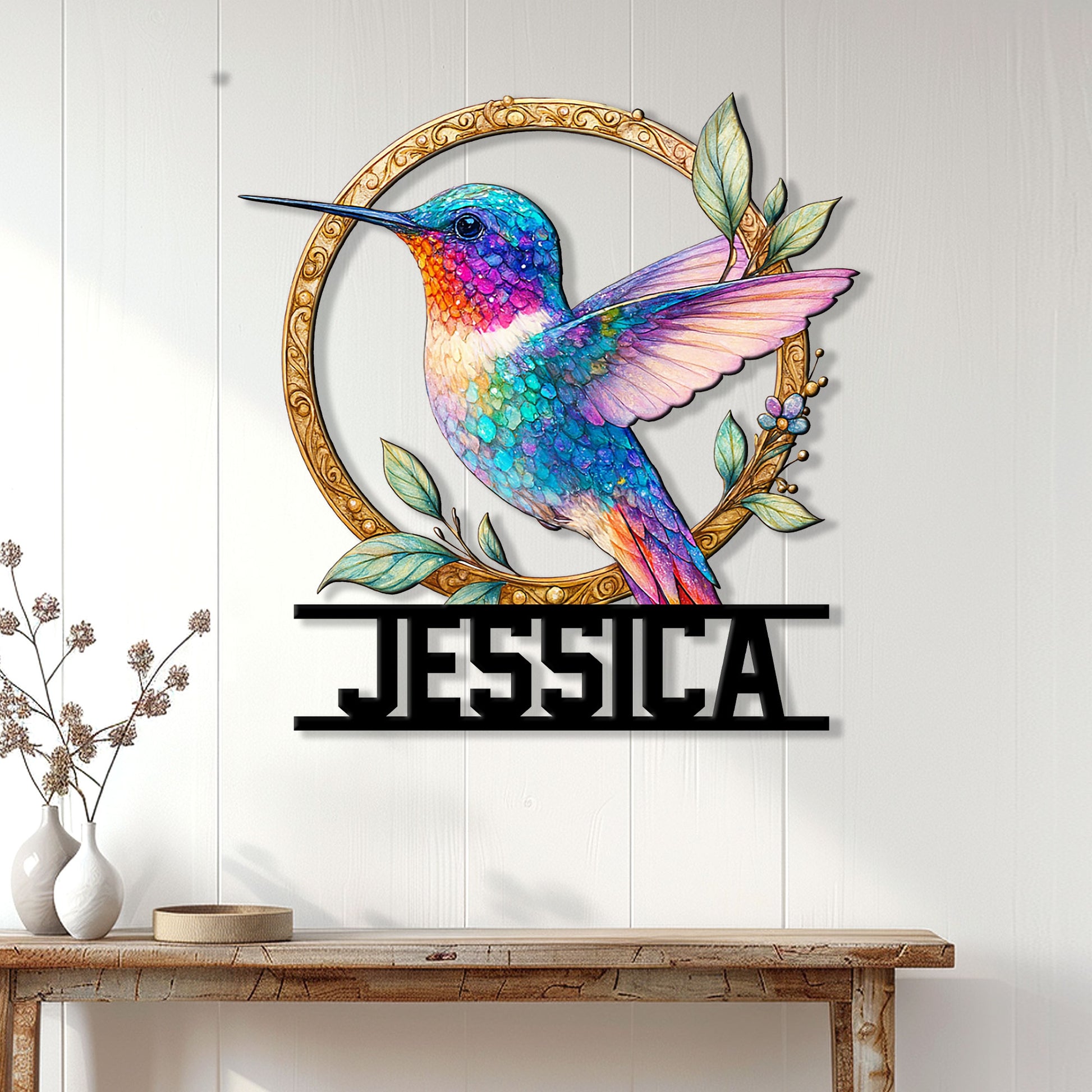 Hummingbird wall sign displayed above a console table in a bright, modern home interior