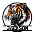 Bold orange and black tiger head metal sign with a fierce expression and circular frame