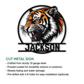 Close view of a roaring tiger metal sign featuring detailed stripes and a dramatic wildlife design