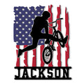 Custom BMX rider silhouette metal sign with an American flag background and bold wall decor design
