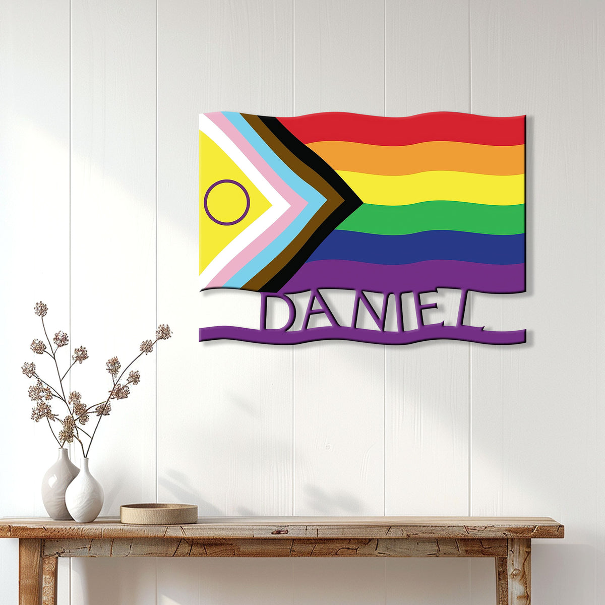 Progress Pride flag metal sign displayed as colorful LGBTQ wall decor in a bright modern living space