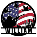 Duck hunting metal sign with a hunter silhouette, flying ducks, cattails, and patriotic flag design