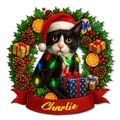 Tuxedo cat wearing a Santa hat and Christmas lights, surrounded by holly, gifts, pinecones, and a red ribbon