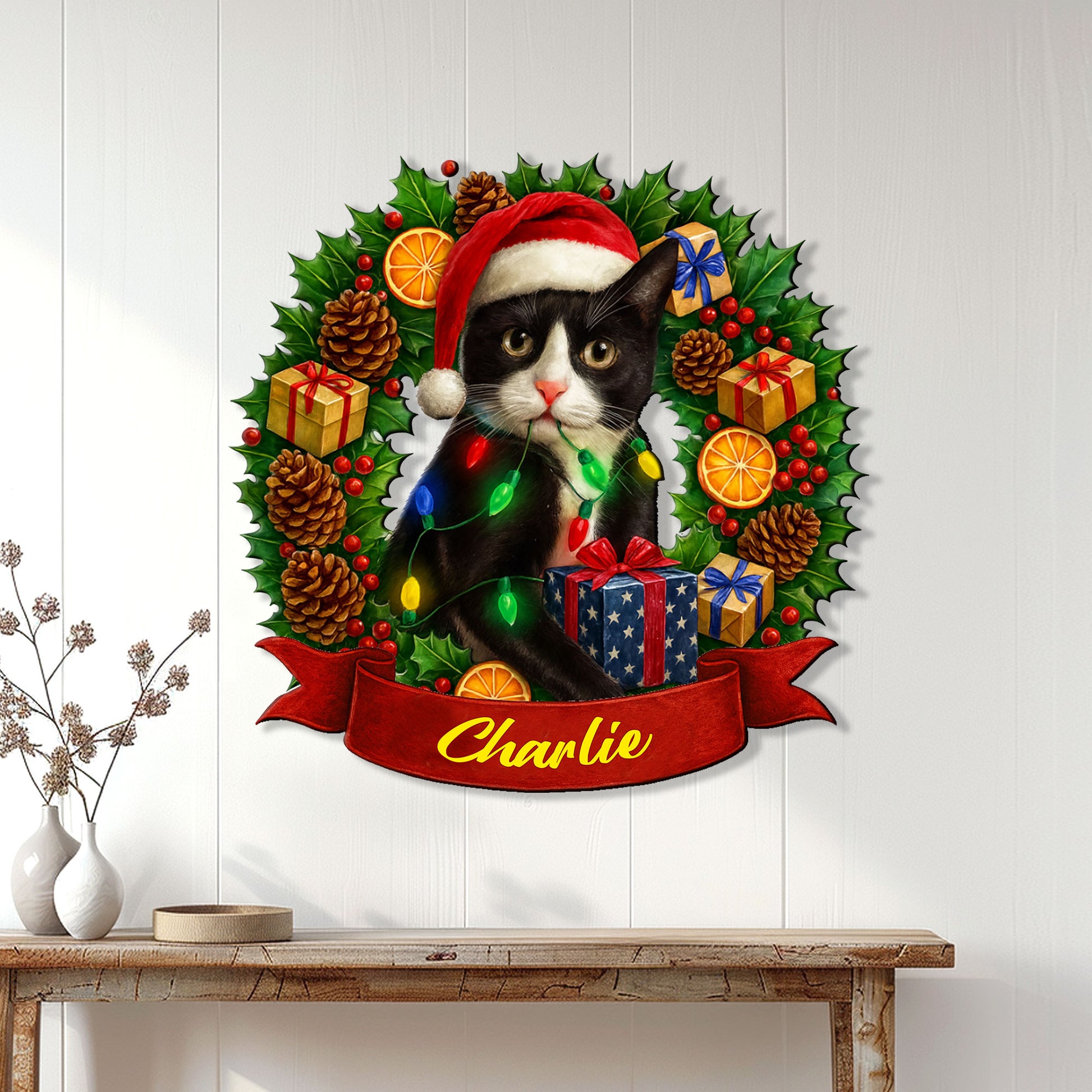 Tuxedo cat Christmas metal sign displayed on a white paneled wall above a console table