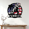 Patriotic dinosaur metal wall sign displayed on a light wood-paneled wall above a console table
