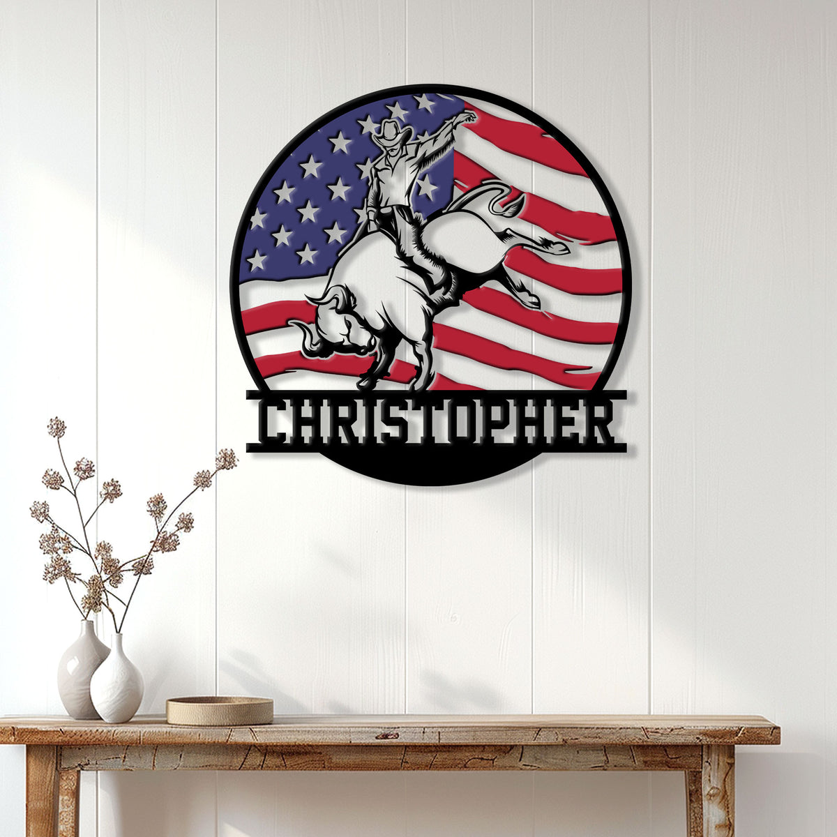 Rodeo bull rider wall sign displayed on a white paneled wall above a rustic console table