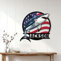 Patriotic shark wall sign displayed on a white paneled wall above a console table