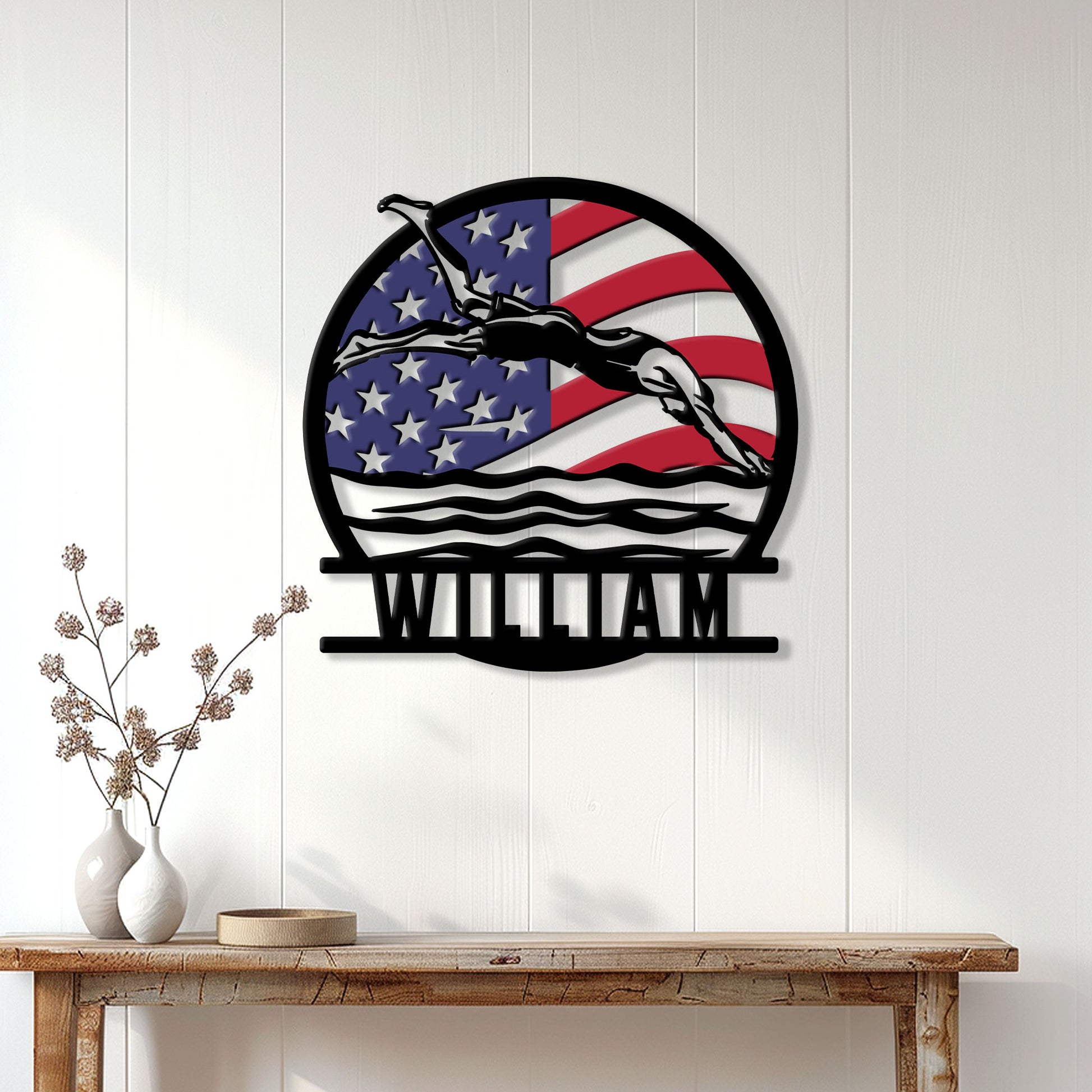 Patriotic swimmer wall decor displayed on a white paneled wall above a wood console table
