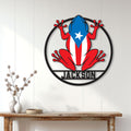 Puerto Rico frog wall sign displayed on a bright white paneled wall above a console table