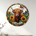 Highland cow wall sign displayed on a light wood-paneled wall above a console table