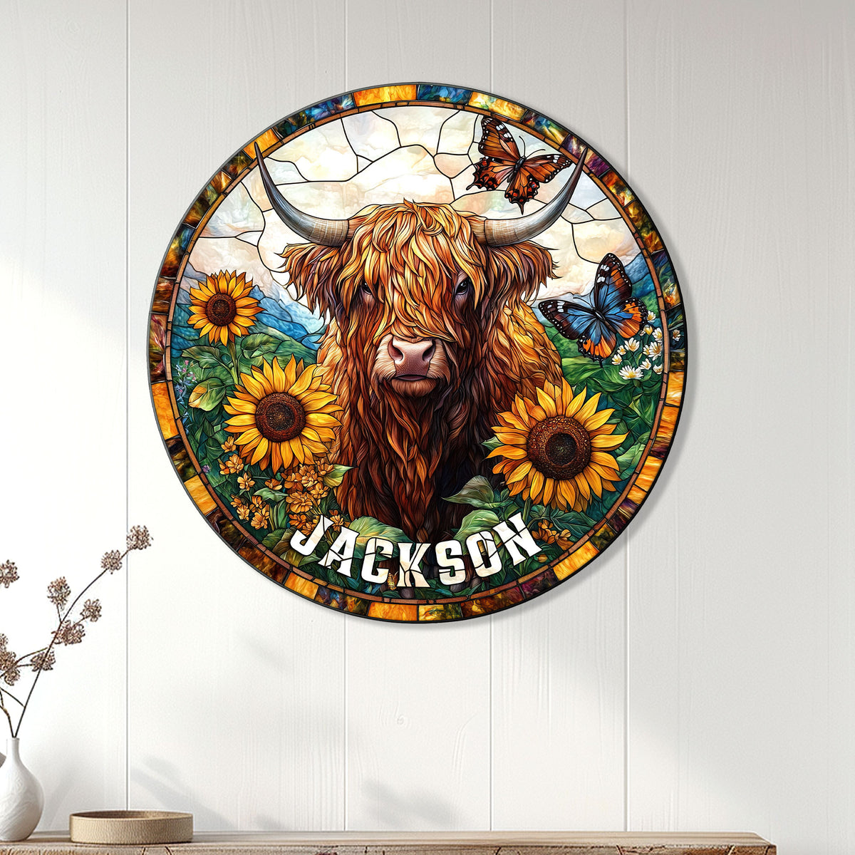 Highland cow wall sign displayed on a light wood-paneled wall above a console table