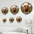 Highland cow metal sign size guide showing six round sign sizes in a bright living room setting