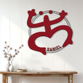 Puerto Rico-inspired red metal wall sign displayed on a bright paneled wall above a console table