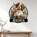 Cavalier King Charles Spaniel floral metal sign displayed on a light wood-paneled wall