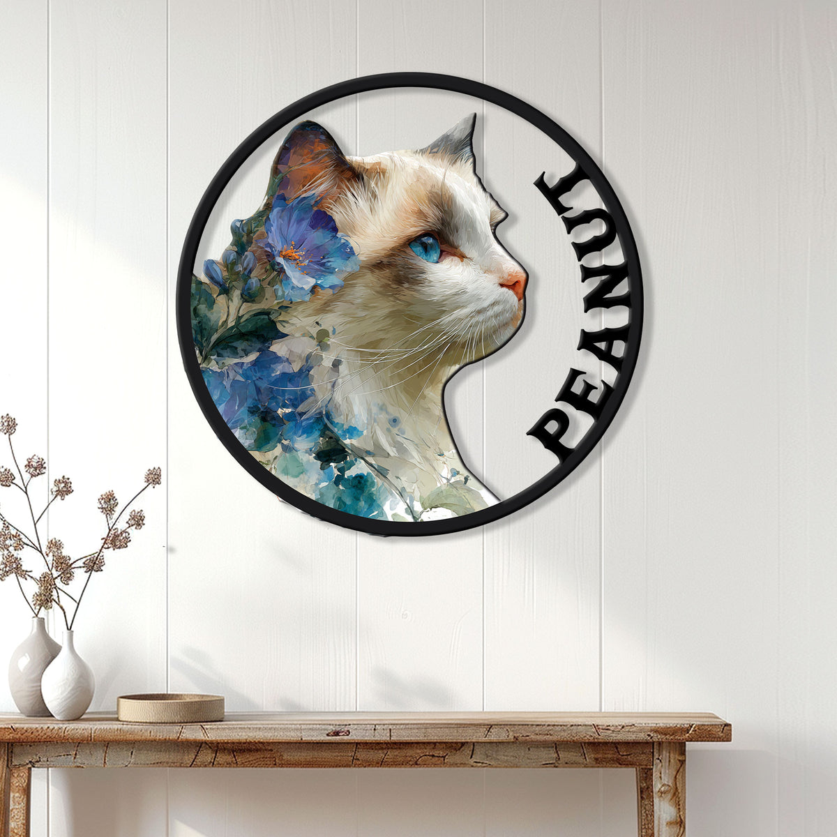 Floral Ragdoll cat wall sign displayed on a white paneled wall above a wooden console