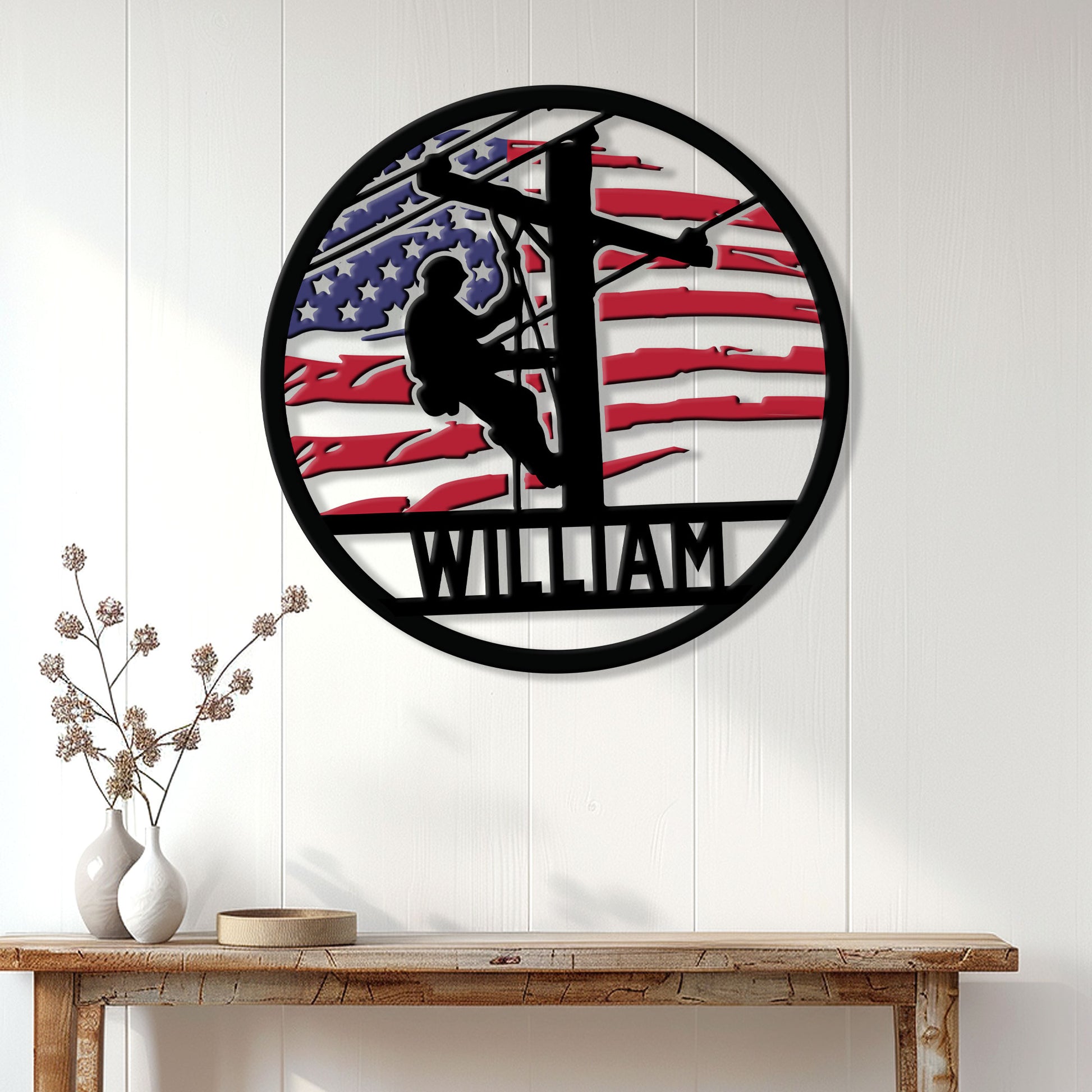 Patriotic lineman wall sign displayed on white paneling above a rustic wood console table