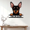Miniature Pinscher wall sign displayed on a white paneled wall in a home entryway