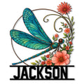Colorful blue dragonfly metal sign surrounded by coral flowers and greenery in a decorative floral design
