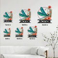 Dragonfly metal sign size guide showing multiple square size options styled on a living room wall