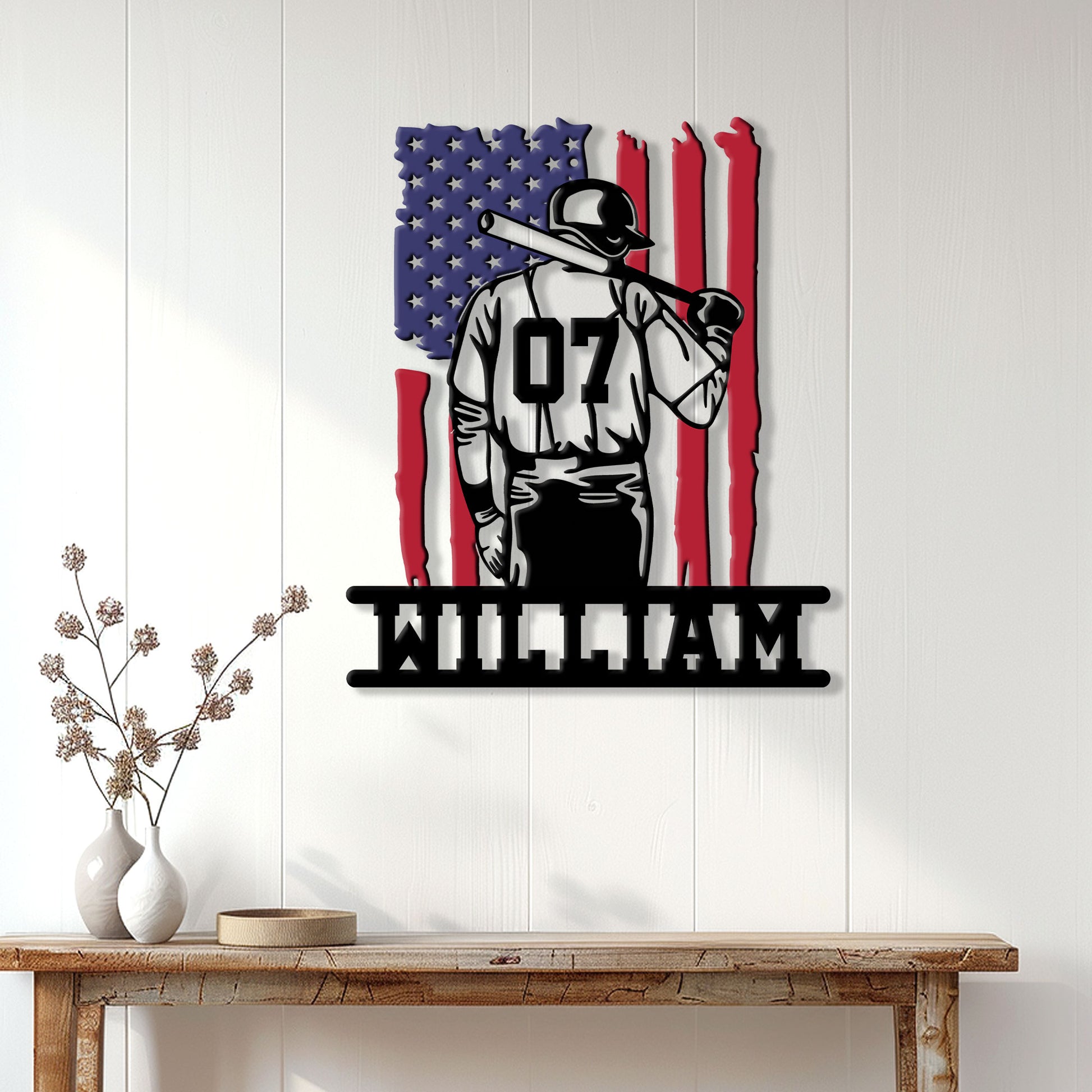 Patriotic baseball player metal wall sign displayed on a light wood-paneled wall above a console table