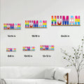 LGBTQ pride HUMAN metal sign shown in multiple sizes on a living room wall