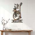 Camouflage deer metal wall sign styled in a bright entryway above a rustic console table