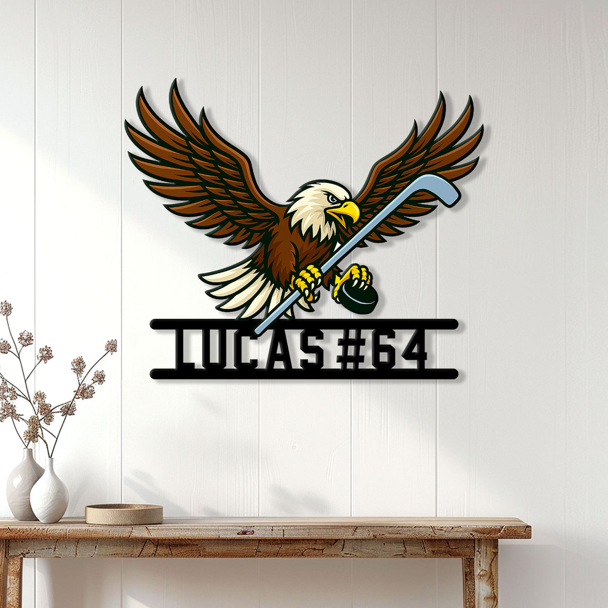 Eagle hockey metal sign displayed on a white paneled wall above a console table