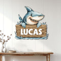 Shark metal wall sign displayed on a light paneled wall above a wooden console table