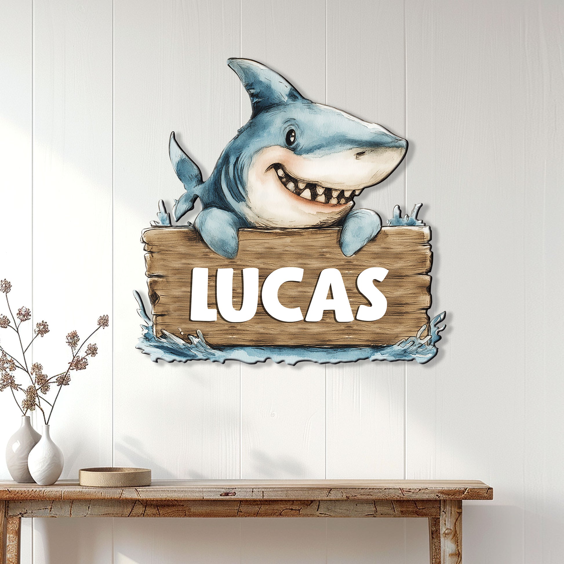 Shark metal wall sign displayed on a light paneled wall above a wooden console table