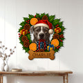 Festive pit bull metal sign displayed on a white plank wall above a console table for holiday home decor