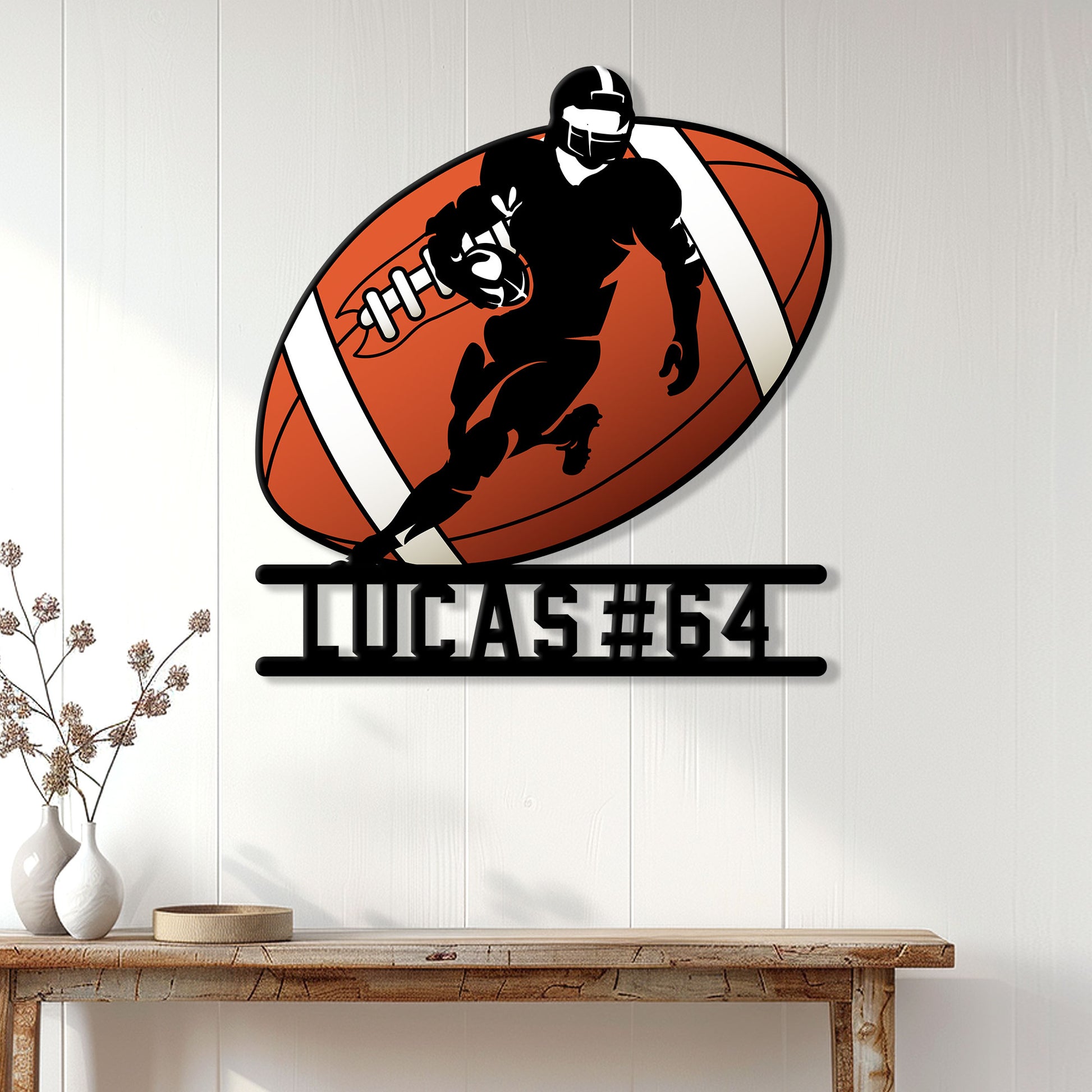 Football player metal sign displayed as wall decor in a bright modern home entryway