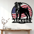 Patriotic American Bulldog wall sign displayed on a light wood-paneled wall above a console table