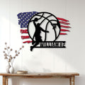 Basketball player metal wall sign displayed above a console table in a bright home interior