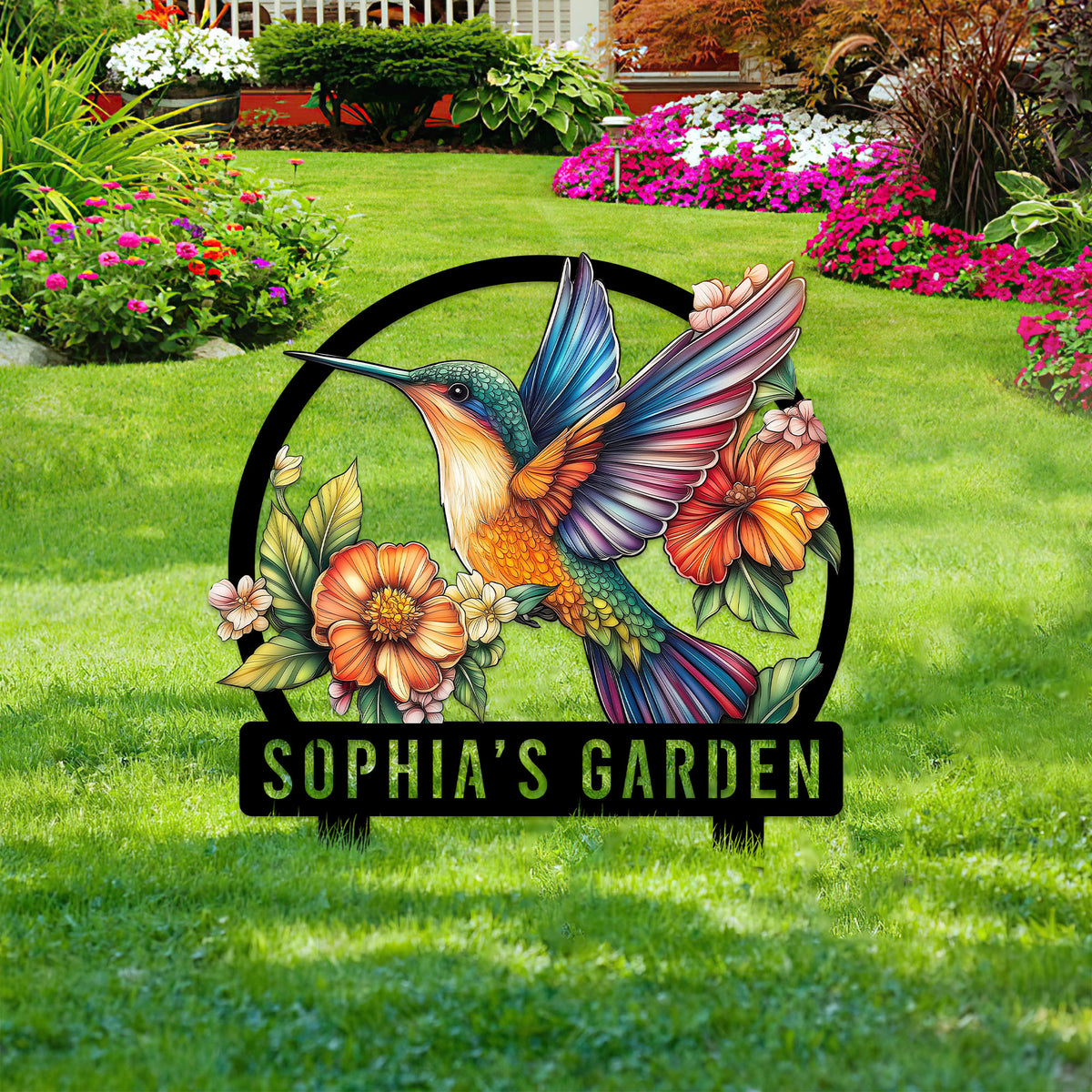 Hummingbird garden sign displayed among blooming flower beds and lush green landscaping