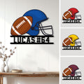 Football helmet and ball metal sign displayed as wall decor with multiple color examples