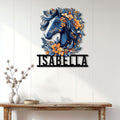 Floral horse wall sign displayed on a light paneled wall above a rustic console table