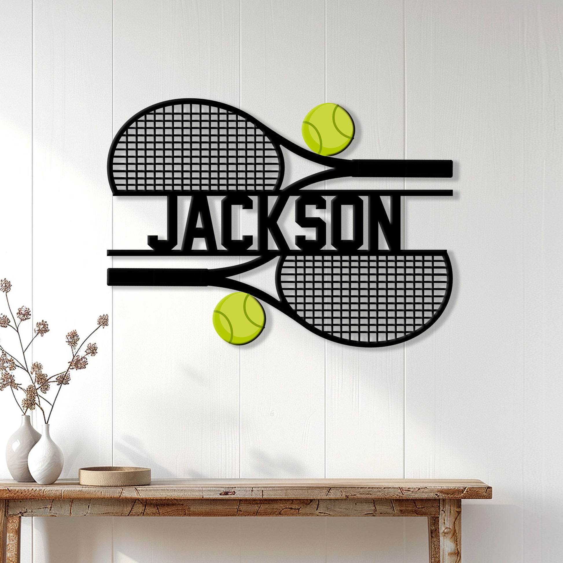 Tennis wall decor displayed above a console table with crossed rackets and bright tennis balls