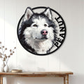 Alaskan Malamute portrait metal sign displayed as wall decor on a bright white paneled entryway