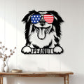 Australian Shepherd wall sign displayed on a light wood-paneled wall above a console table