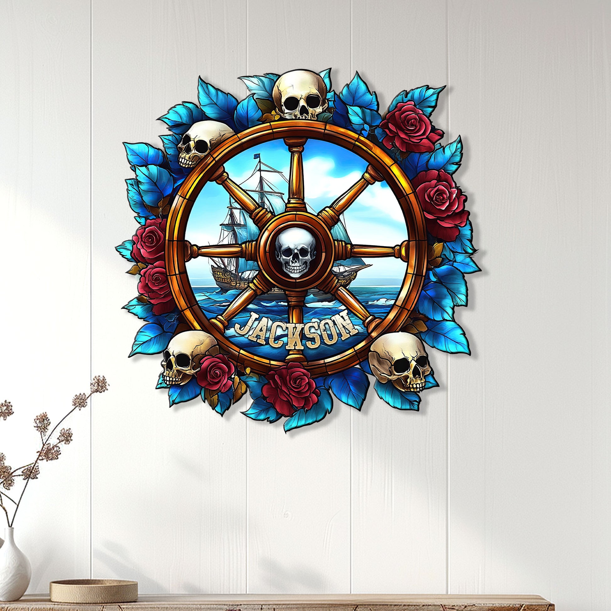 Pirate skull ship wheel metal sign displayed as nautical wall decor on a light wood-paneled wall