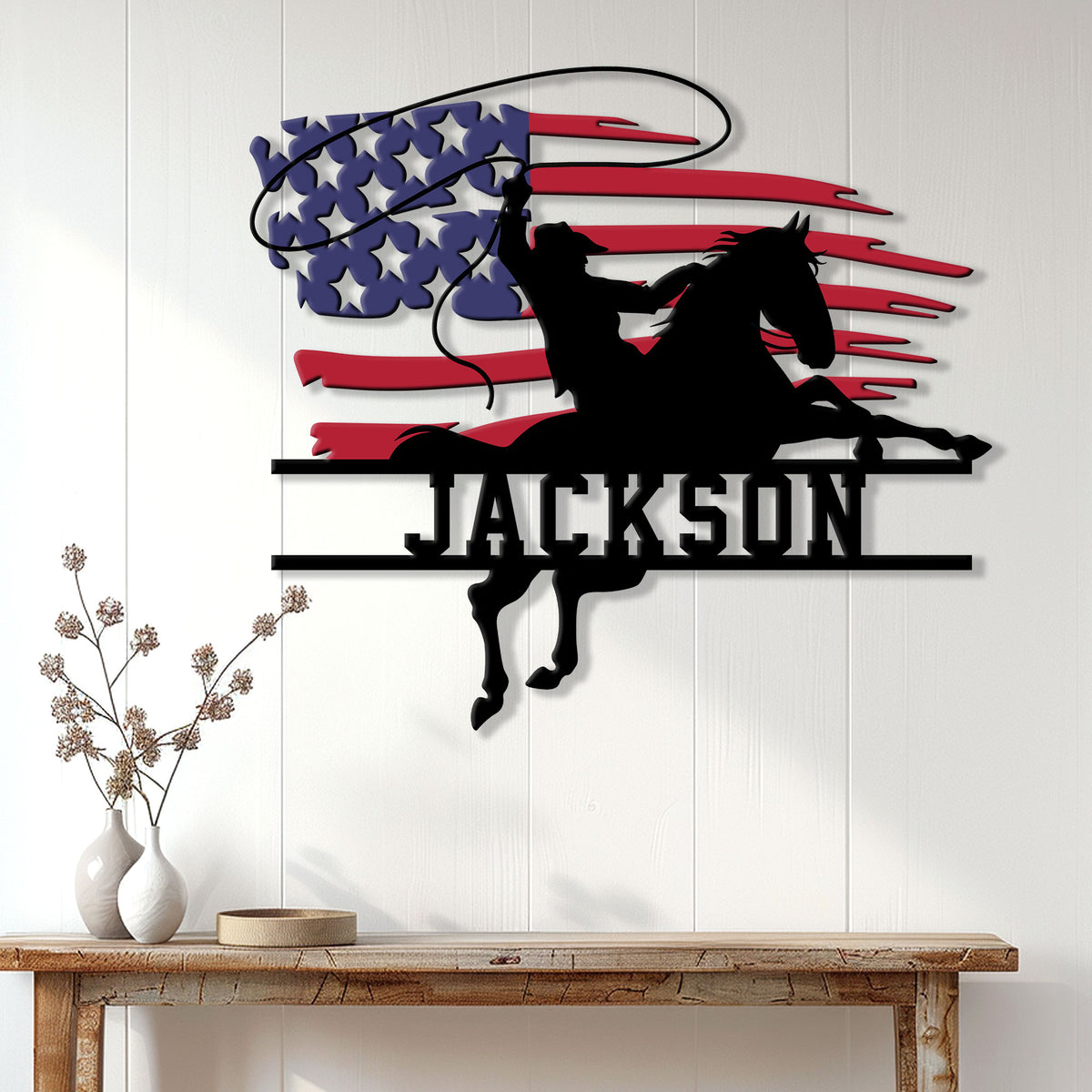 Cowboy and bucking horse silhouette metal wall sign displayed on a white paneled wall