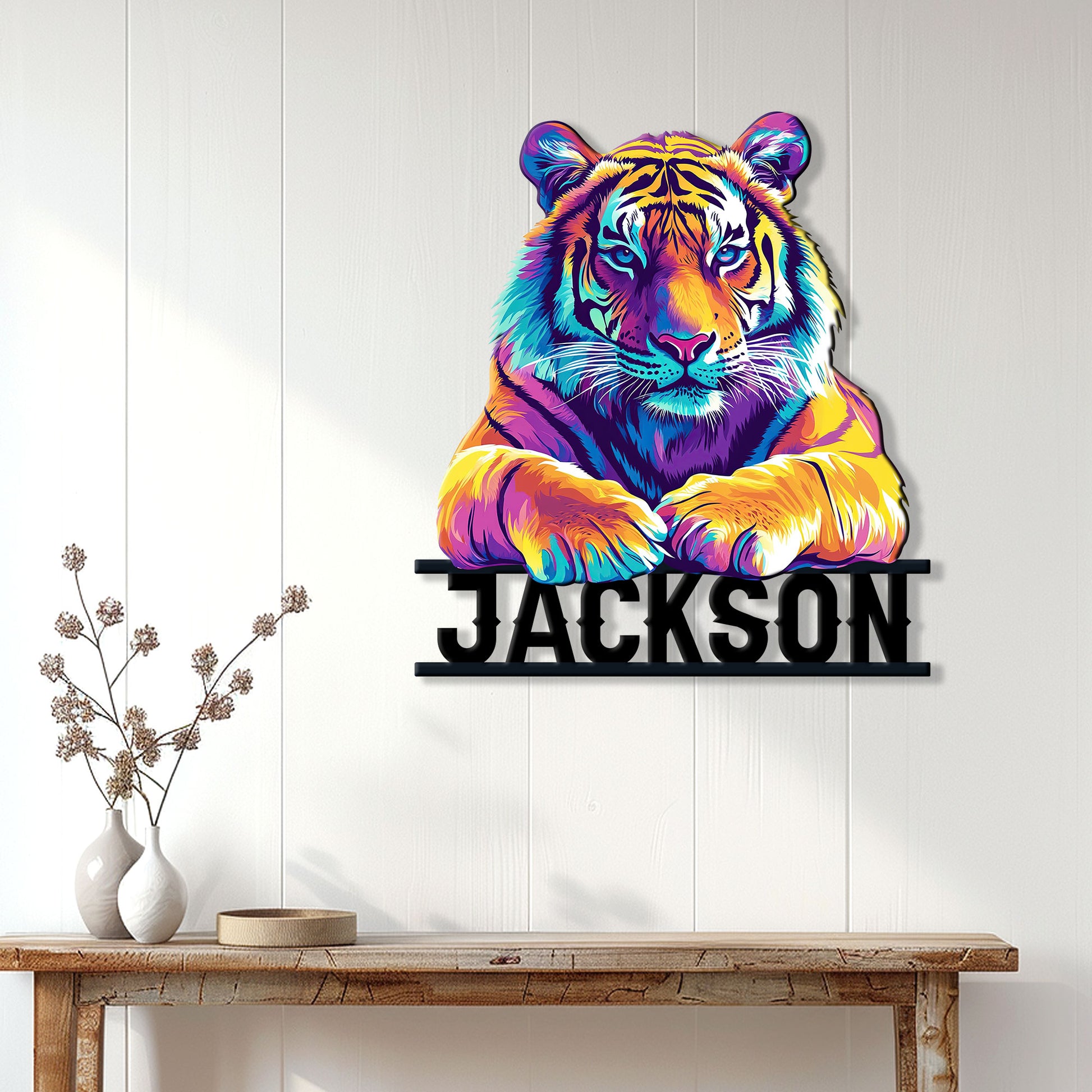 Vivid tiger metal sign displayed on a white paneled wall above a rustic entryway table