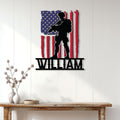 Patriotic military wall decor displayed on a white paneled wall above a console table