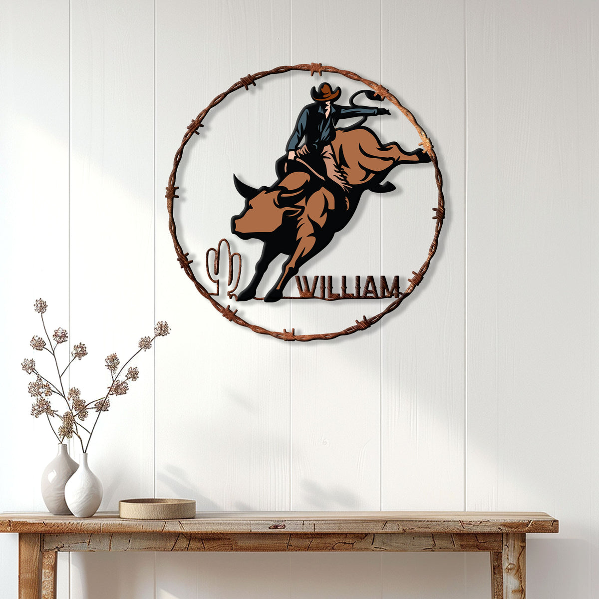 Rodeo bull riding metal sign displayed on a white paneled wall above a rustic console table