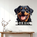 Rottweiler metal wall sign displayed on a light wood-paneled wall above a console table